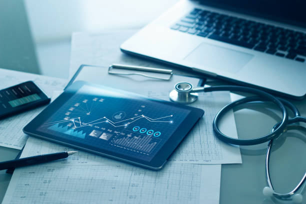 Decorative; iPad and laptop with medical graphs displayed